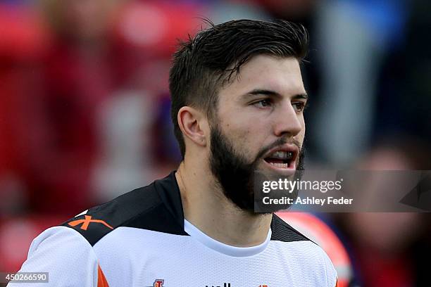 James Tedesco of the Tigers runs out onto the field during the round 13 NRL match between the Newcastle Knights and the Wests Tigers at Hunter...