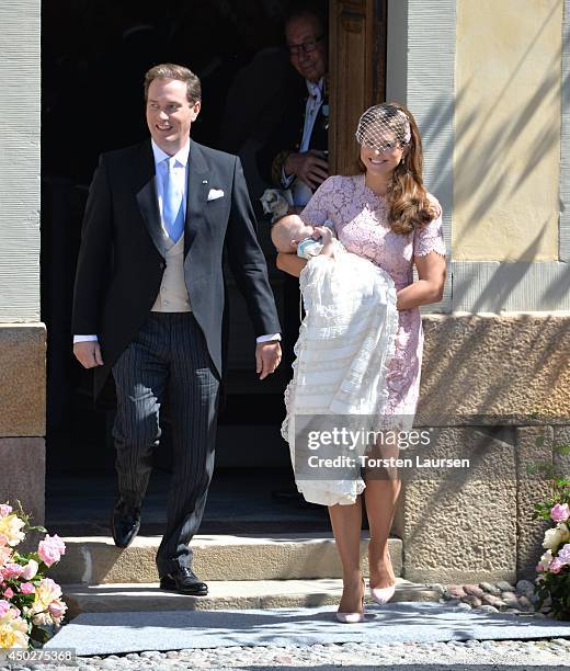 Christopher O'Neill and Princess Madeleine of Sweden carry their daughter Princess Leonore, Duchess of Gotland after her Royal Christening at...