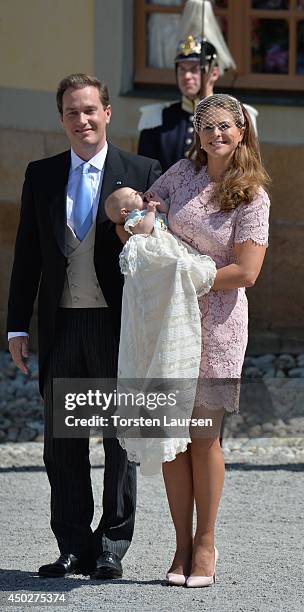 Christopher O'Neill and Princess Madeleine of Sweden carry their daughter Princess Leonore, Duchess of Gotland after her Royal Christening at...