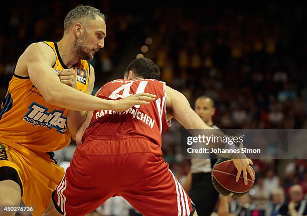 Boris Savovic of Muenchen fights for the ball with Sven Schultze of Berlin during the Beko BBL Playoff Final Game 1 between FC Bayern Muenchen and...