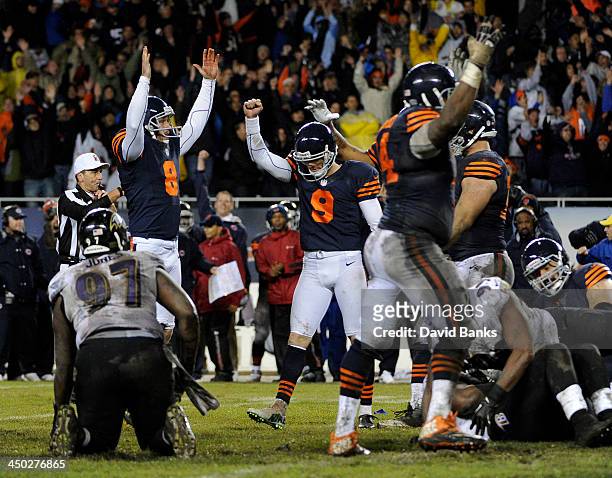 Robbie Gould of the Chicago Bears reacts after kicking the game winning field goal against the Baltimore Ravens during overtime on November 17, 2013...