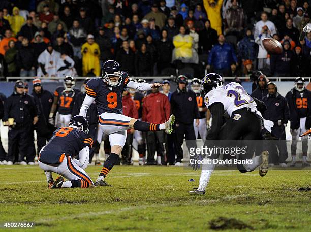 Robbie Gould of the Chicago Bears kicks the game winning field goal against the Baltimore Ravens during overtime on November 17, 2013 at Soldier...