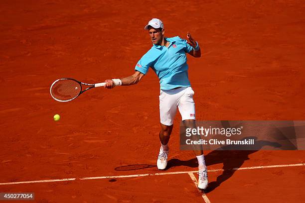 Novak Djokovic of Serbia returns a shot during his men's singles final match against Rafael Nadal of Spain on day fifteen of the French Open at...