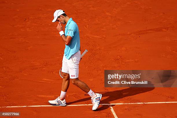 Novak Djokovic of Serbia reacts during his men's singles final match against Rafael Nadal of Spain on day fifteen of the French Open at Roland Garros...