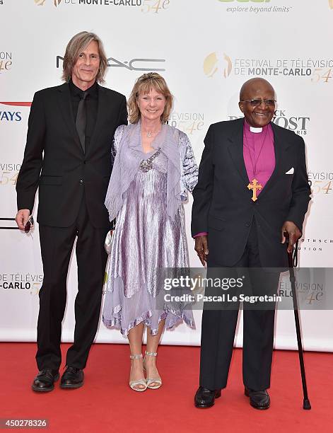 Ivan Suvanjieff, Dawn Engle and Desmond Tutu attend a photocall during the 54th Monte-Carlo Television Festival at Grimaldi Forum on June 8, 2014 in...