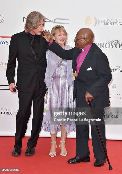 Ivan Suvanjieff, Dawn Engle and Desmond Tutu attend a photocall during the 54th Monte-Carlo Television Festival at Grimaldi Forum on June 8, 2014 in...