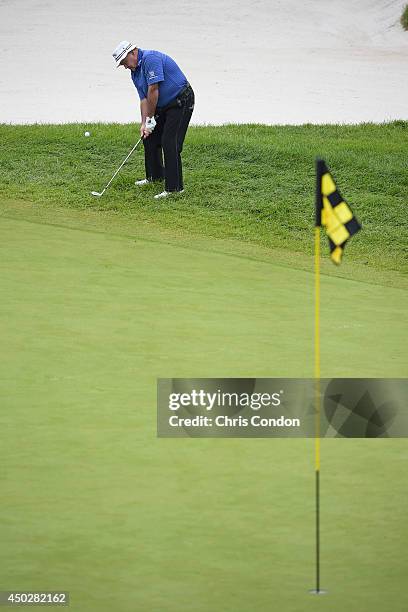 Jim Colbert chips to the first green while competing in the final round of the Legends division of the Big Cedar Lodge Legends of Golf presented by...