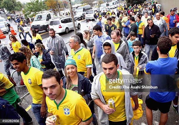Brazilian fans walk toward the stadium prior to the International Friendly Match between Brazil and Serbia at Morumbi Stadium on June 06, 2014 in Sao...