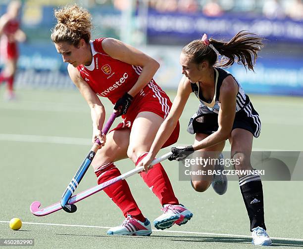 England's Ashleigh Ball and Argentina's Florencia Habif play during a stage match in the women's tournament of the Field Hockey World Cup in The...