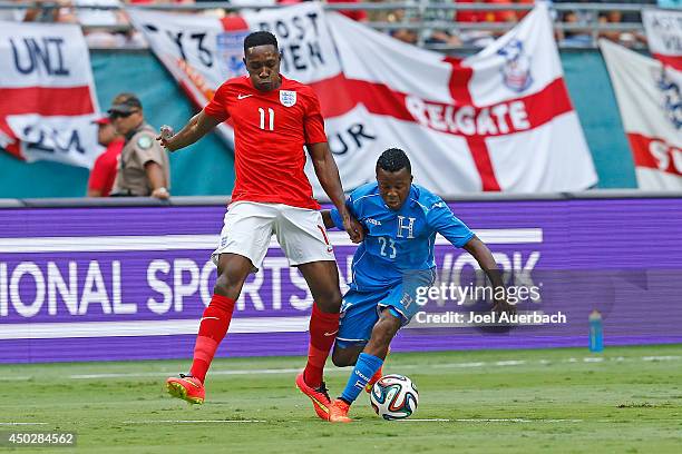 Danny Welbeck of England and Marvin Chavez of Honduras battle for control of the ball on June 7, 2014 during an International friendly match at...