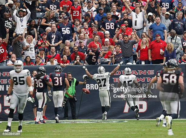 Rashad Jennings of the Oakland Raiders celebrates his 80 yard touchdown run against the Houston Texans on November 17, 2013 at Reliant Stadium in...