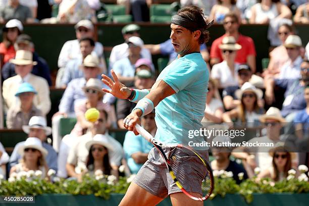 Rafael Nadal of Spain returns a shot during his men's singles final match against Novak Djokovic of Serbia on day fifteen of the French Open at...