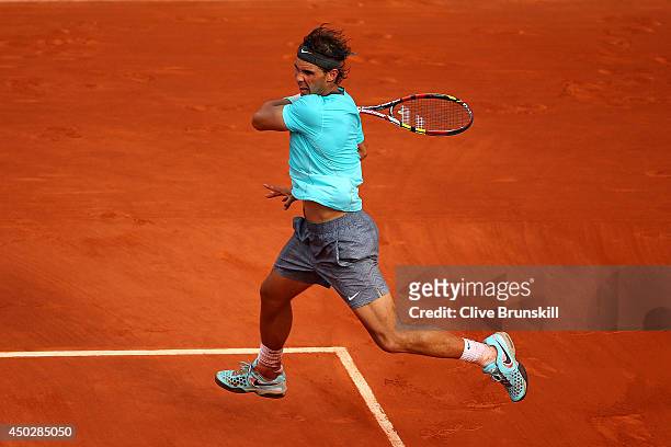 Rafael Nadal of Spain returns a shot during his men's singles final match against Novak Djokovic of Serbia on day fifteen of the French Open at...