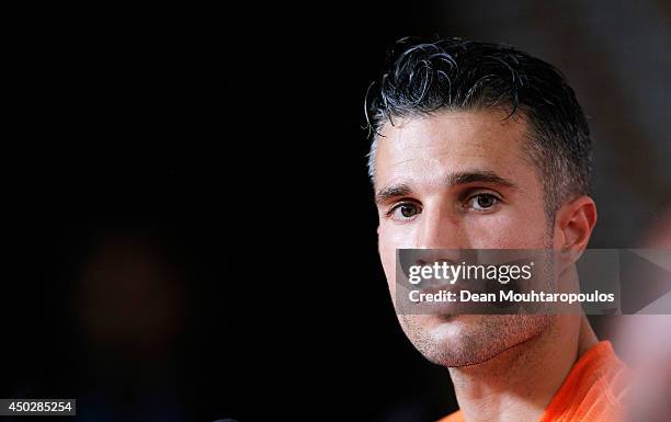 Robin van Persie speaks to the media during the Netherlands Press Conference at the 2014 FIFA World Cup Brazil held at the Estadio Jose Bastos...