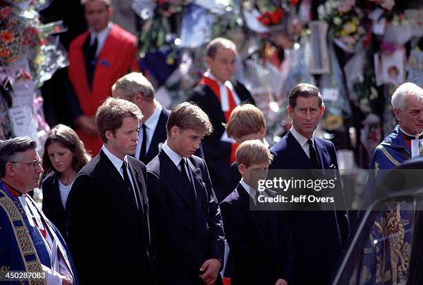 Funeral of Diana, Princess of Wales - L-R Earl Spencer Prince Charles Prince William Harry and Prince Charles stand alongside the hearse containing...