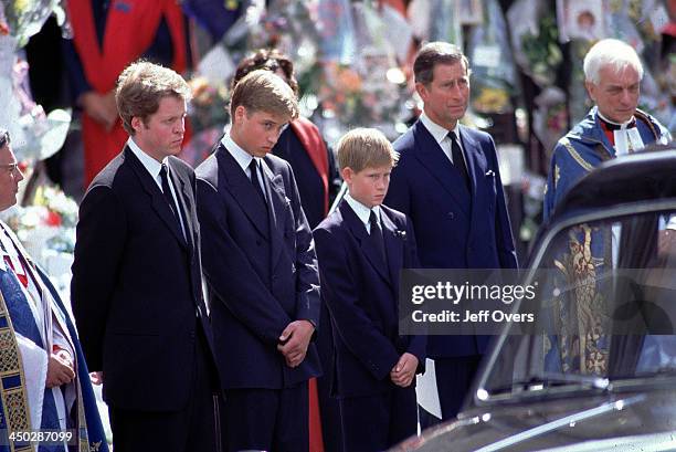 Funeral of Diana, Princess of Wales - L-R Earl Spencer Prince Charles Prince William Harry and Prince Charles stand alongside the hearse containing...