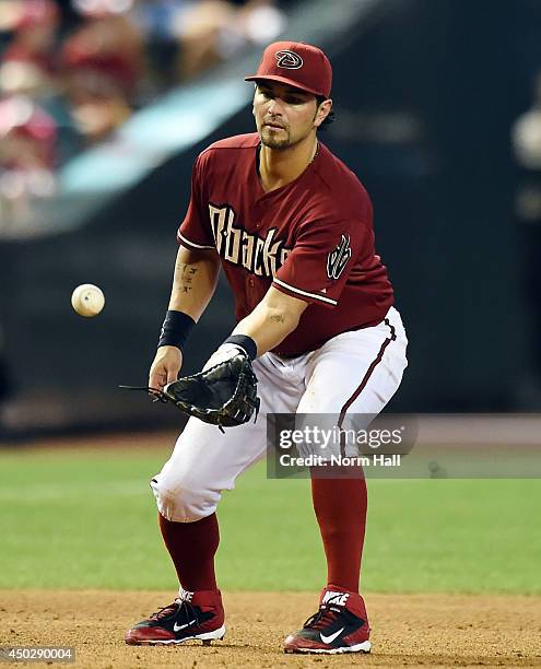 Eric Chavez of the Arizona Diamondbacks makes a play on a bouncing ball against the Cincinnati Reds at Chase Field on June 1, 2014 in Phoenix,...