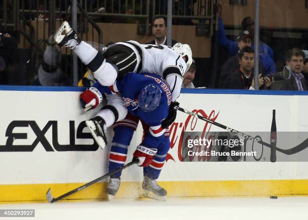 Anton Stralman of the New York Rangers checks Dustin Brown of the Los Angeles Kings during the second period at Madison Square Garden on November 17,...