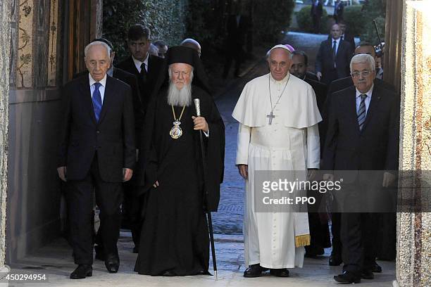 In this handout photo provided by the Palestinian Press Office , Pope Francis meets Israeli President Shimon Peres , Palestinian President Patriarch...