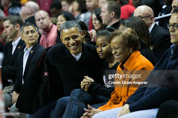 President Barack Obama, Sasha Obama and Marian Robinson attend a men's NCCA basketball game between University of Maryland and Oregon State...