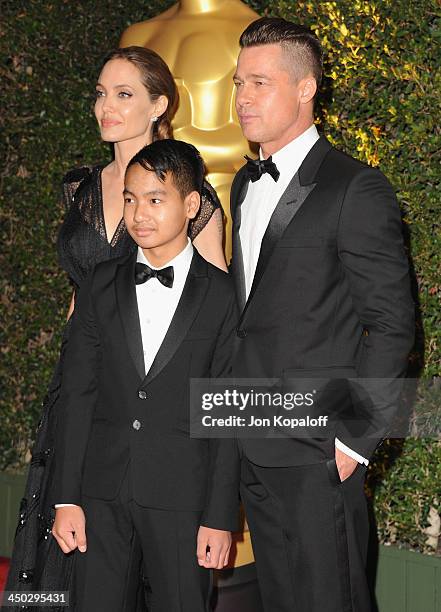 Actress Angelina Jolie, Maddox Jolie-Pitt and actor Brad Pitt arrive at The Board Of Governors Of The Academy Of Motion Picture Arts And Sciences'...