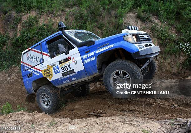 Four-wheel drive car races during the tenth Albania's Rally near the village of Petrela on June 8, 2014. Over 170 contestants from 23 nationalities...