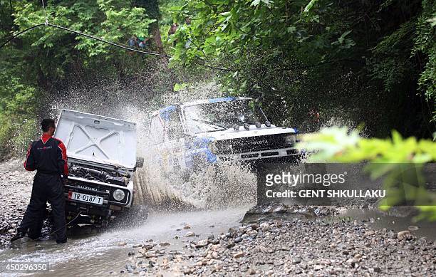 Four-wheel drive cars race during the tenth Albania's Rally near the village of Petrela on June 8, 2014. Over 170 contestants from 23 nationalities...