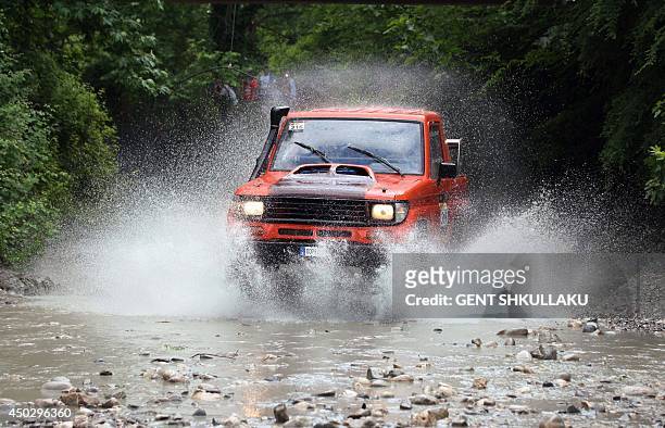 Four-wheel drive car competes during the tenth Albania's Rally near the village of Petrela on June 8, 2014. Over 170 contestants from 23...