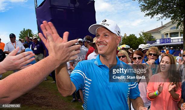 Ben Crane celebrates with fans after winning the FedEx St. Jude Classic at TPC Southwind on June 8, 2014 in Memphis, Tennessee.