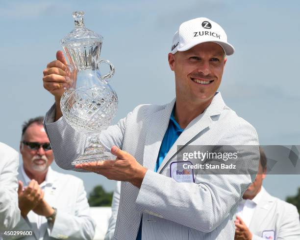 Ben Crane poses with the trophy after finishing as champion of the FedEx St. Jude Classic at TPC Southwind on June 8, 2014 in Memphis, Tennessee.