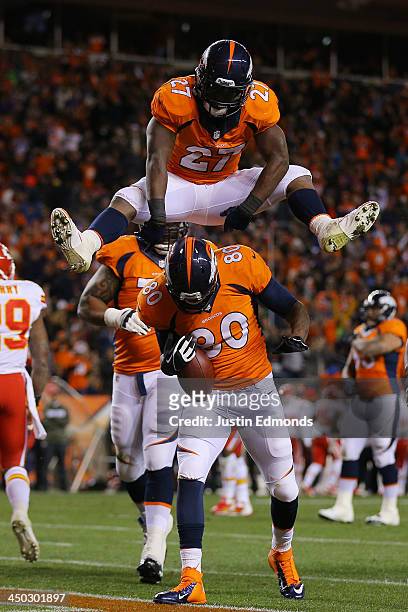 Julius Thomas celebrates hjis first quarter touchdown against the Kansas City Chiefs with Knowshon Moreno of the Denver Broncos at Sports Authority...