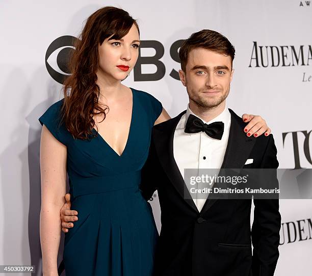 Erin Darke and Daniel Radcliffe attend the 68th Annual Tony Awards at Radio City Music Hall on June 8, 2014 in New York City.