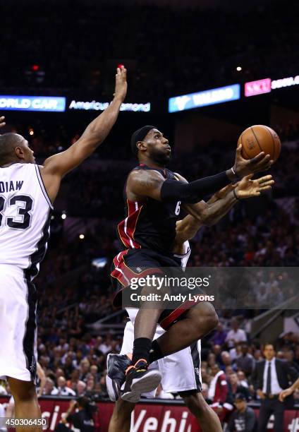 LeBron James of the Miami Heat drives to the basket against Boris Diaw of the San Antonio Spurs during Game Two of the 2014 NBA Finals at the AT&T...