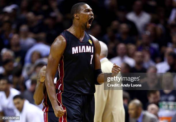 Chris Bosh of the Miami Heat reacts against the San Antonio Spurs during Game Two of the 2014 NBA Finals at the AT&T Center on June 8, 2014 in San...