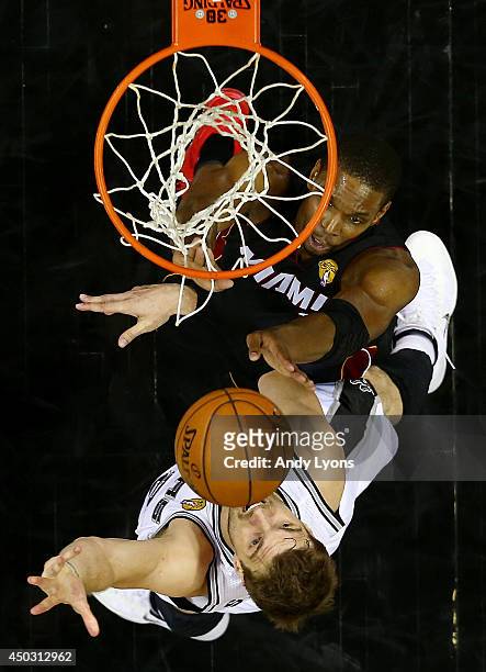 Tiago Splitter of the San Antonio Spurs goes to the basket against Chris Bosh of the Miami Heat during Game Two of the 2014 NBA Finals at the AT&T...