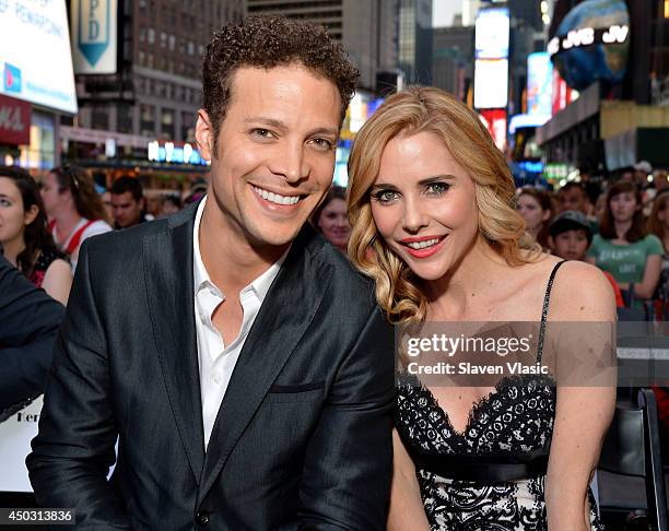 Hosts Justin Guarini and Kerry Butler pose on stage during the 68th Annual Tony Awards Times Square Simulcast at Times Square on June 8, 2014 in New...
