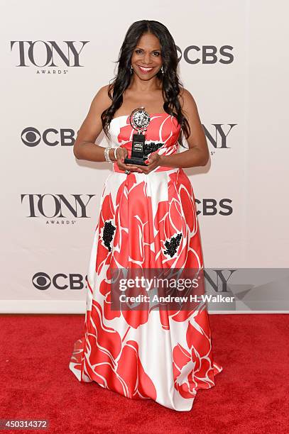 Audra McDonald winner of the award for Best Performance by an Actress in a Leading Role in a Play for "Lady Day" poses in the press room during the...