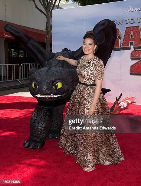 Actress America Ferrera and Toothless the dragon arrive at the Los Angeles premiere of "How To Train Your Dragon 2" at the Regency Village Theatre on...