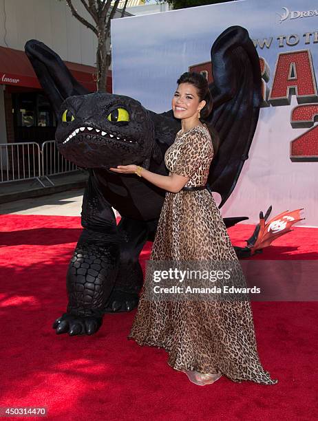 Actress America Ferrera and Toothless the dragon arrive at the Los Angeles premiere of "How To Train Your Dragon 2" at the Regency Village Theatre on...