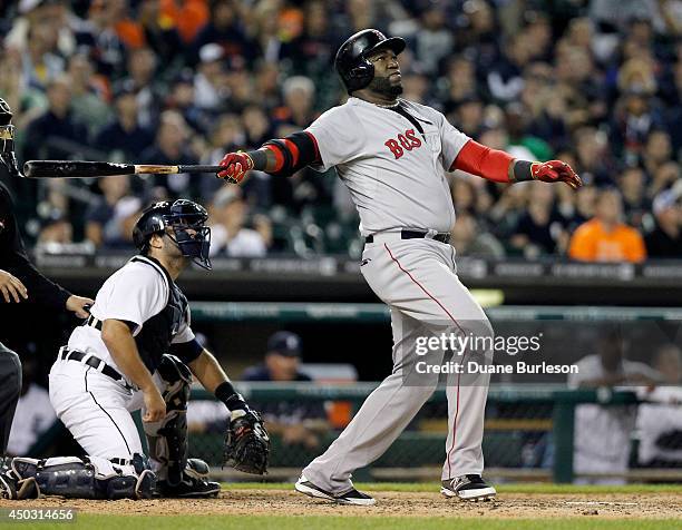 David Ortiz of the Boston Red Sox hits a three-run home run that gives the Red Sox a 5-3 lead with catcher Alex Avila of the Detroit Tigers in the...