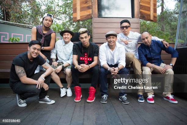 Actor/singer Roshon Fegan poses with The Jabbawockeez backstage at the "Rebuild!" benefit concert for Typhoon Haiyan survivors at The Greek Theatre...