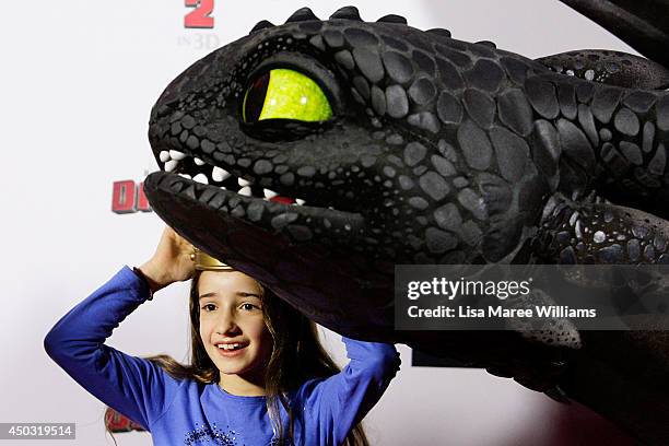 Young girl meets Toothless the dragon at the 'How To Train Your Dragon 2' Australian premiere at Event Cinemas George Street on June 9, 2014 in...