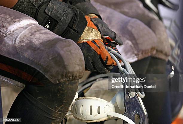 Corey Wootton of the Chicago Bears holds his helmet on the bench during a game against the Baltimore Ravens at Soldier Field on November 17, 2013 in...