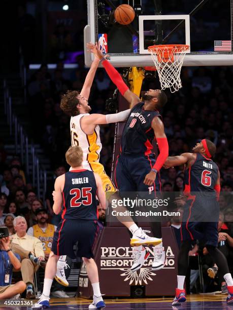 Pau Gasol of the Los Angeles Lakers shoots over Andre Drummond of the Detroit Pistons at Staples Center on November 17, 2013 in Los Angeles,...