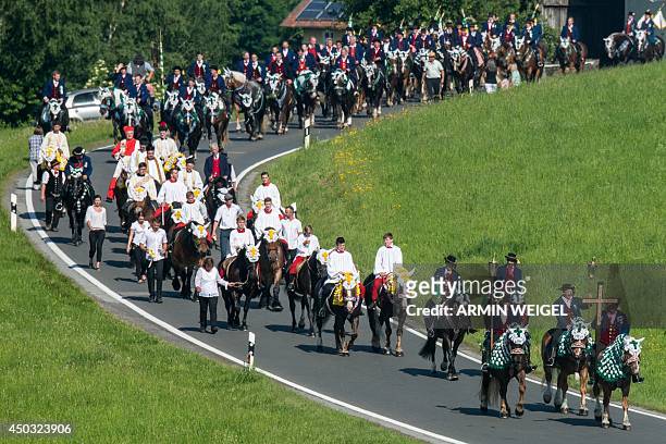 Participants of the Pentecostal horse ride parade on June 9, 2014 near Bad Koetzting, Germany. The procession with around 900 riders is one of the...
