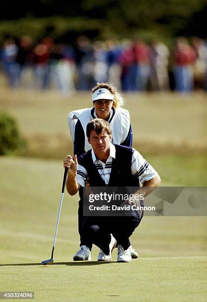 Nick Faldo of England with his caddie Fanny Sunesson of Sweden on the way to his win in the 119th Open Championship played on the Old Course at St...