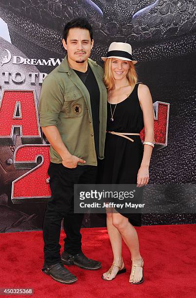 Actor Jesse Garcia and guest arrive at the Los Angeles premiere of 'How To Train Your Dragon 2' at the Regency Village Theatre on June 8, 2014 in...