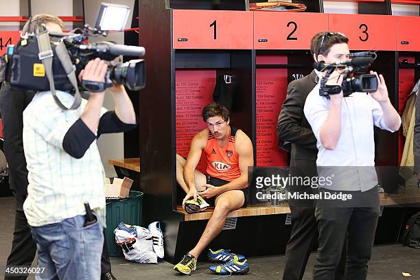 Michael Hibberd gets dressed in the changerooms while media go on a tour at the new Essendon Bombers AFL training facility at Tullamarine on November...