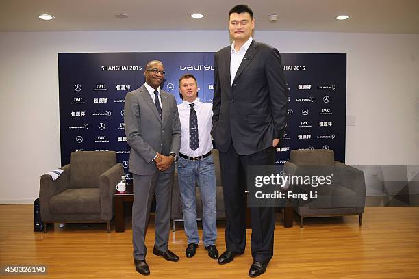 Laureus Academy Chairman Edwin Moses, Laureus Academy Member Russian gymnast Alexei Nemov and former NBA player Yao Ming pose for photos before a...