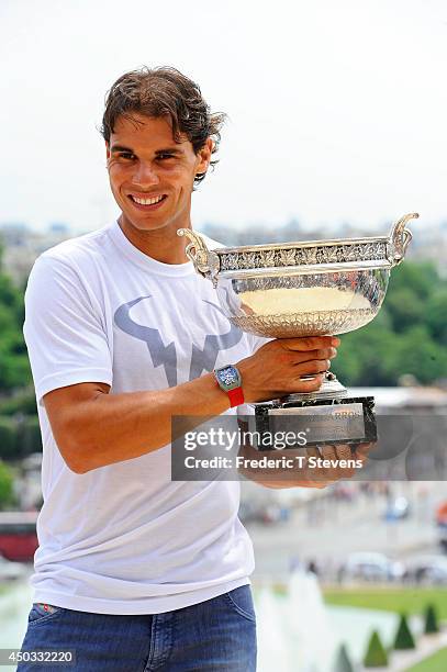 Rafael Nadal of Spain poses with the Coupe des Mousquetaires trophy in front of the Eiffel Tower after his victory against Novak Djokovic of Serbia...